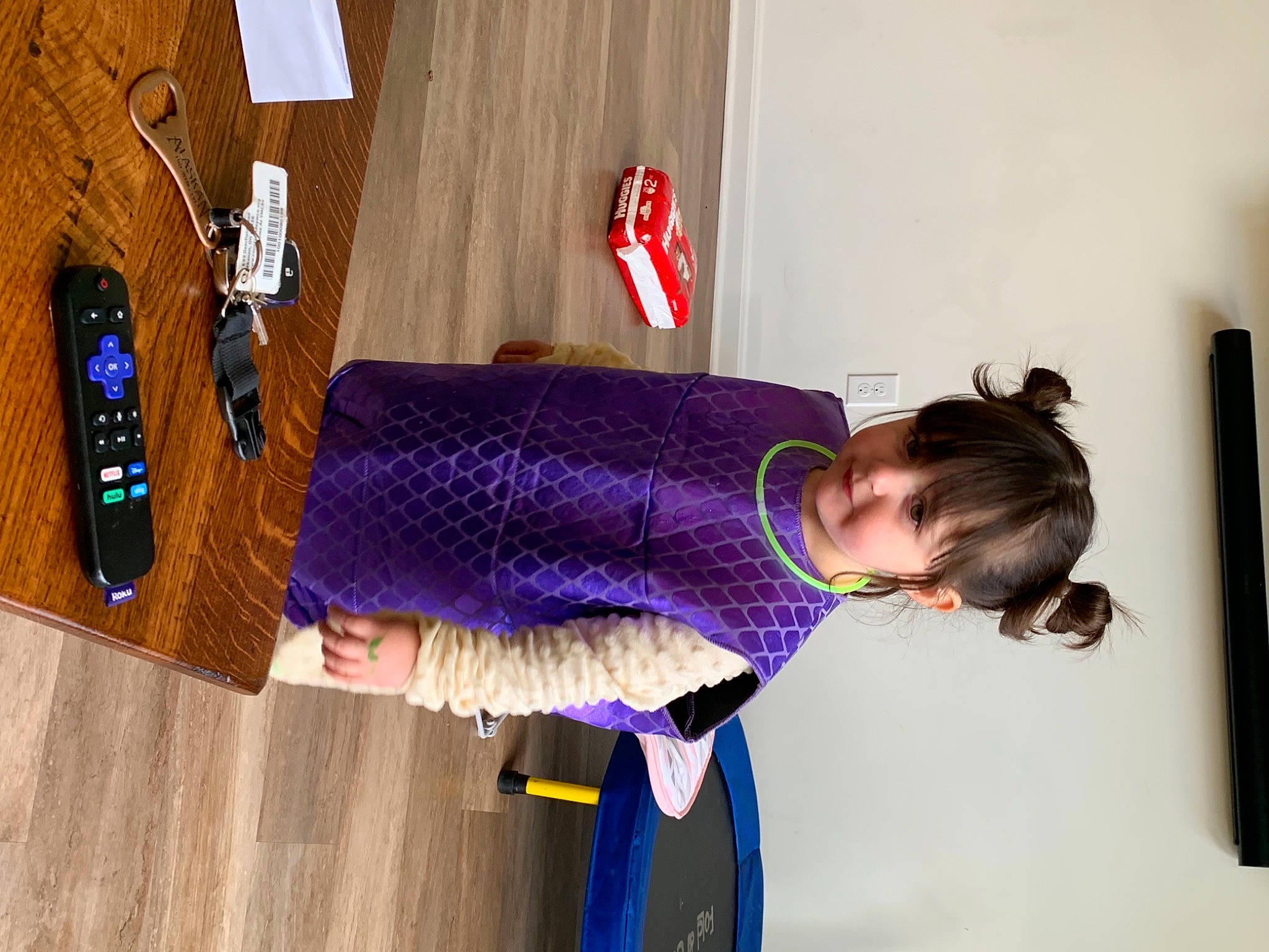 Ainsley is registered to the contest to win money with this photo: baby_toddler_clothing, child, electric_blue, flooring, fun, hardwood, leisure, magenta, pattern, person, purple, room, sleeve, street_fashion, toddler, varnish, violet, wood, wood_stain, wool