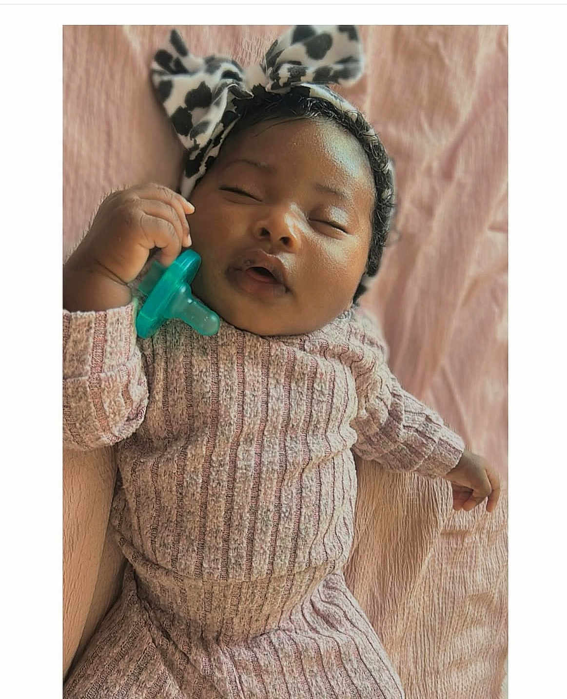 Heiress J is registered to the contest to win money with this photo: baby, sleeping, pacifier, headband, bow, knitwear, ribbed_clothing, pink_blanket, infant, cute, peaceful, hand, portrait, soft_lighting, closeup, child, resting, indoors, cozy, adorable