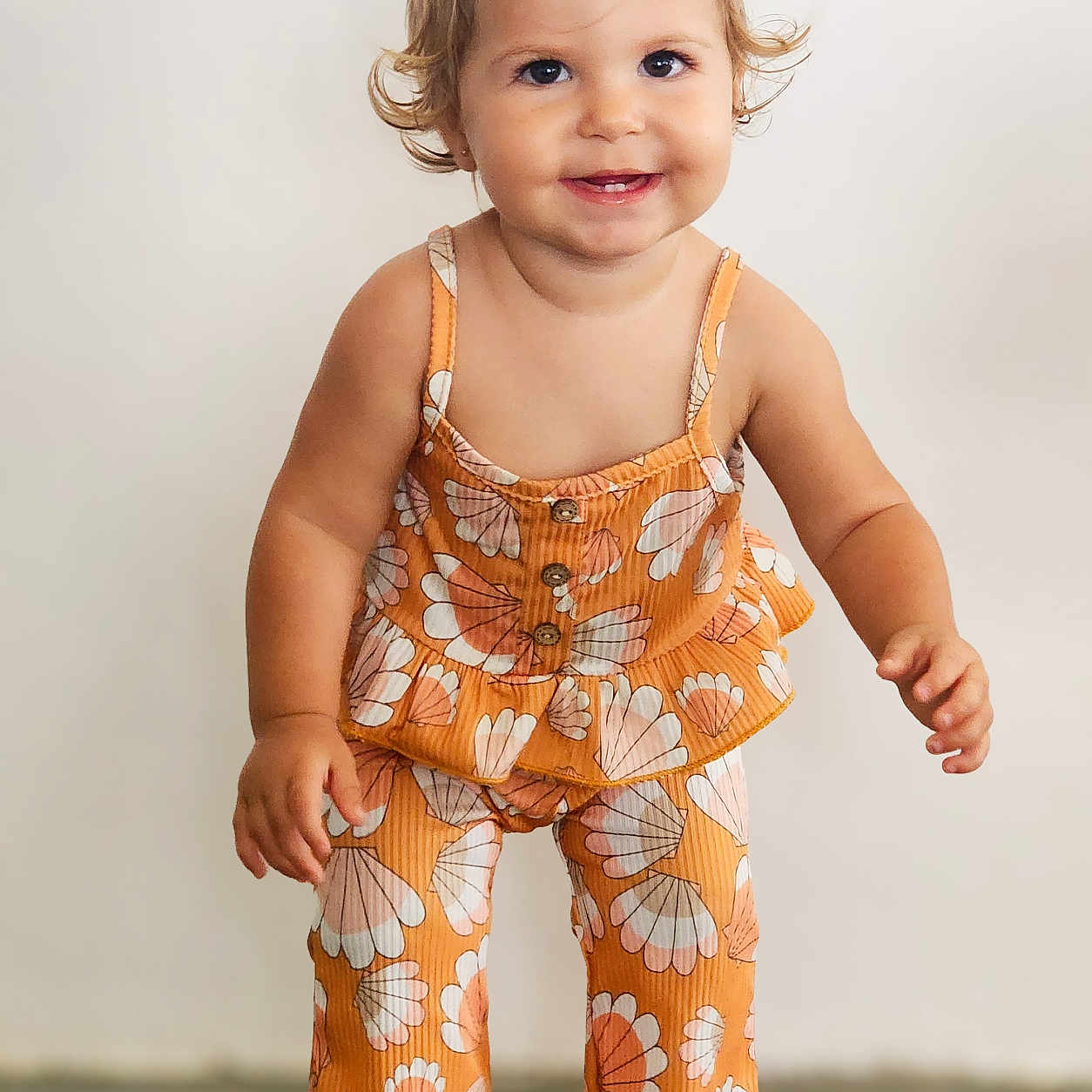 Frankie is registered to the contest to win money with this photo: bodypart, child, clothing, dress, face, female, finger, formalwear, girl, hand, happy, head, pajamas, pants, person, photography, portrait, smile, standing, suit