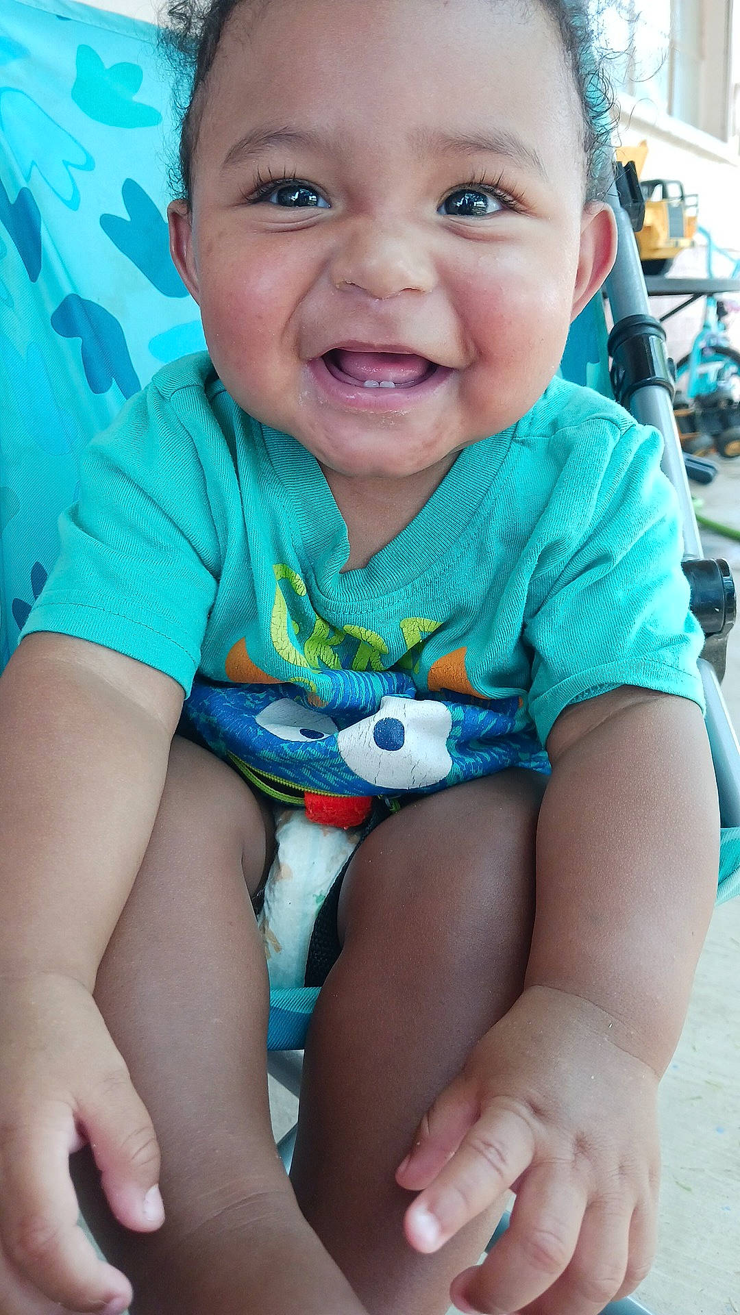 Amari joined the competition — help win amazing prizes! baby, baby_toddler_clothing, blue, cheek, child, electric_blue, fun, grass, happy, joy, leisure, mouth, nose, person, pink, sitting, skin, sleeve, smile, t_shirt