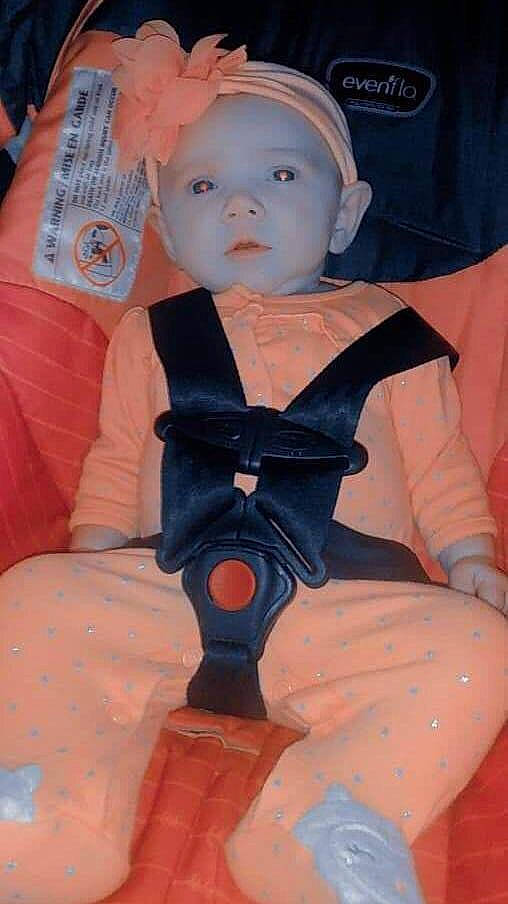Ellis is registered to the contest to win money with this photo: baby, baby_toddler_clothing, cap, cheek, child, fun, headwear, human_leg, orange, pattern, peach, person, pink, sitting, skin, sleeve, thigh, toddler, toy, vintage_clothing