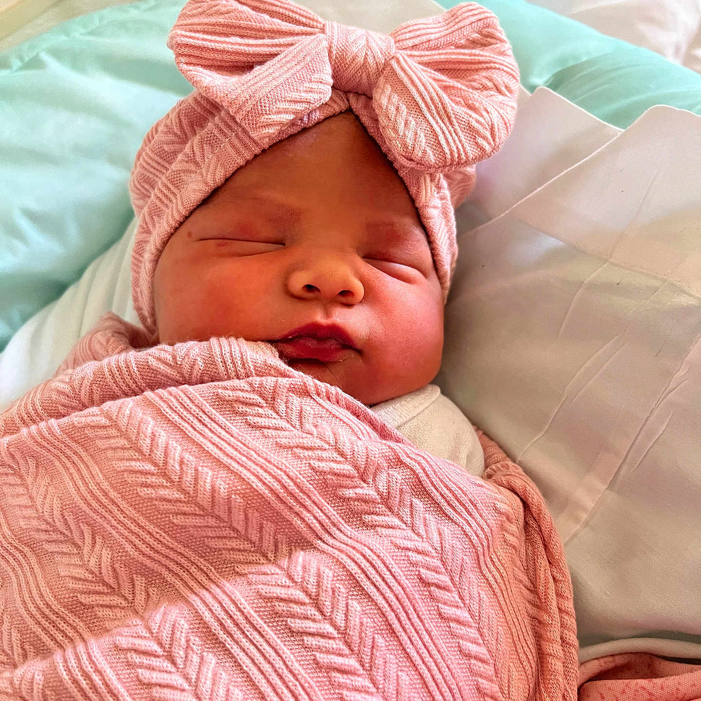 Kylie joined the competition — help win amazing prizes! newborn, baby, sleeping, infant, portrait, face, hospital, bed, blanket, pink, bow, headband, swaddled, peaceful, indoors, close_up, child, soft, resting, photography