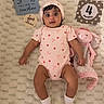Eliana joined the competition — help win amazing prizes! baby, infant, child, portrait, lying_down, blanket, plush_toy, bunny, pink, onesie, strawberry_pattern, hat, socks, milestone_photo, four_months, indoor, cozy, wide_eyed, smiling, nursery