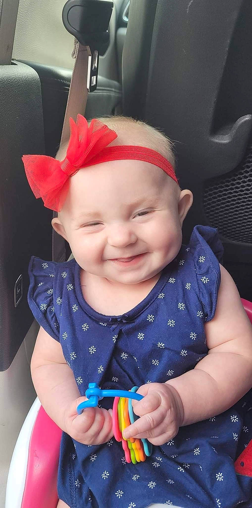 Delyla Sunshine is registered to the contest to win money with this photo: baby, baby_toddler_clothing, cheek, chin, clothing, dress, eye, finger, happy, headwear, human_body, iris, joy, lip, mouth, nose, organ, person, skin, sleeve