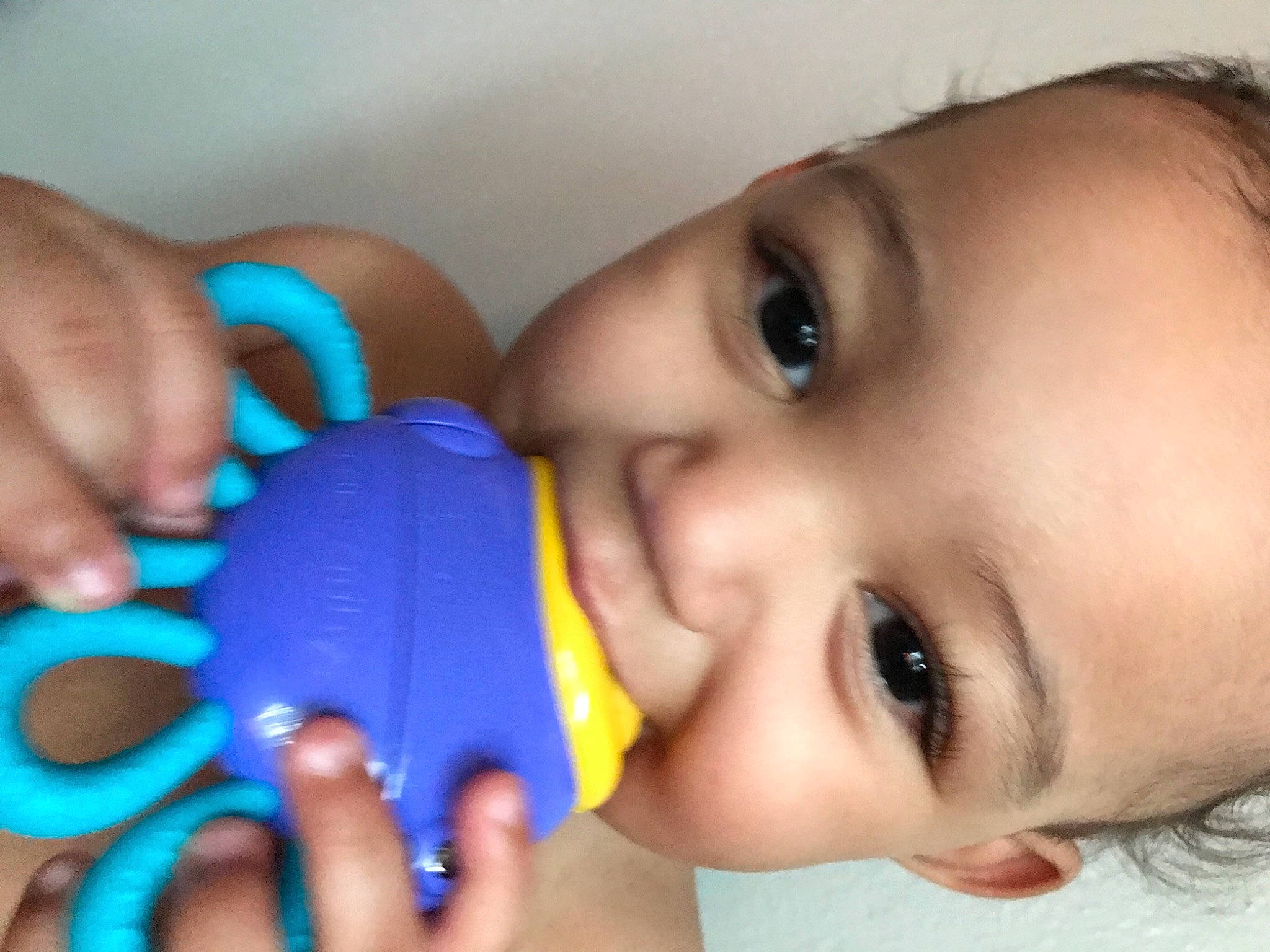 Phillip is registered to the contest to win money with this photo: blue, cheek, drinkware, ear, eye, eyebrow, eyelash, facial_expression, finger, forehead, hand, human_body, iris, lip, mouth, nose, organ, person, skin, smile