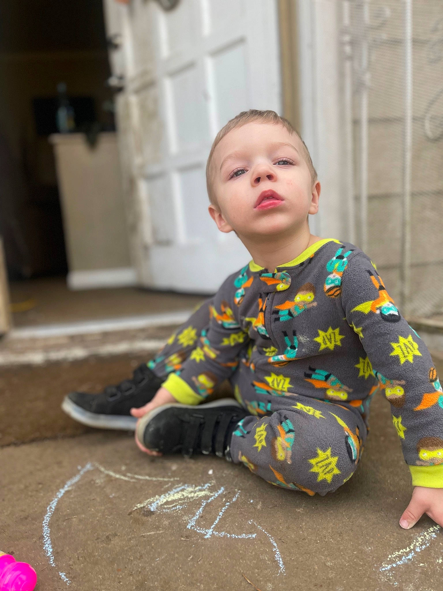 Everett is registered to the contest to win money with this photo: baby, baby_toddler_clothing, carmine, carpet, chalk, child, door, floor, flooring, foot, fun, handwriting, hardwood, human_leg, pattern, person, play, sitting, sleeve, toddler