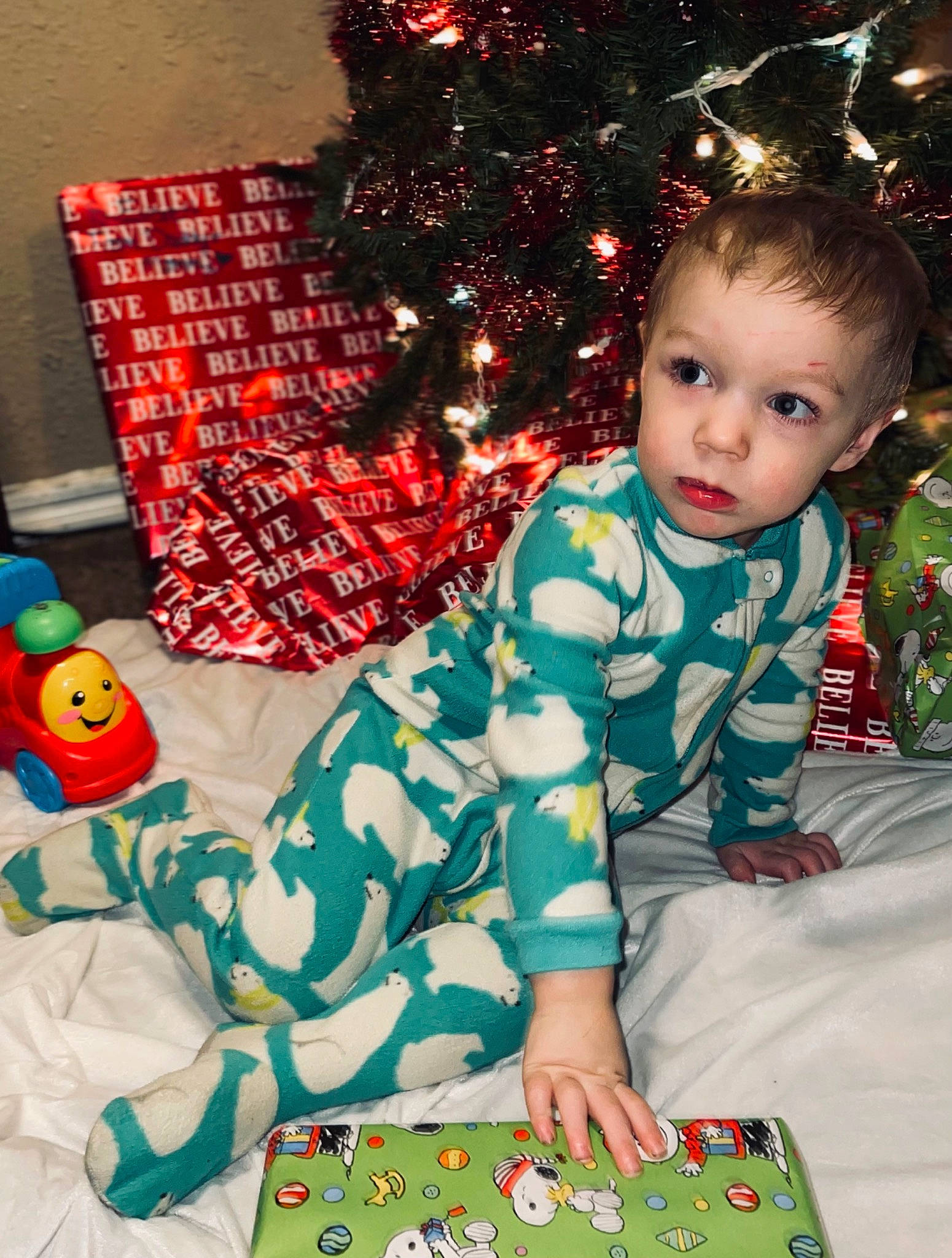 Everett joined the competition — help win amazing prizes! baby_toddler_clothing, child, christmas, christmas_decoration, christmas_ornament, christmas_tree, event, fun, happy, holiday, holiday_ornament, human_body, lap, linens, ornament, pattern, person, red, sitting, sleeve
