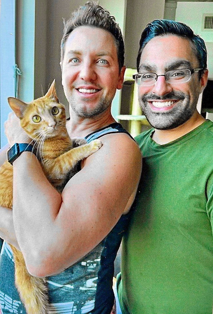 Bee is registered to the contest to win money with this photo: arm, beard, carnivore, cat, eyewear, face, fawn, felidae, gesture, hand, happy, head, interaction, joint, mammal, shoulder, small_to_medium_sized_cats, smile, vertebrate, whiskers