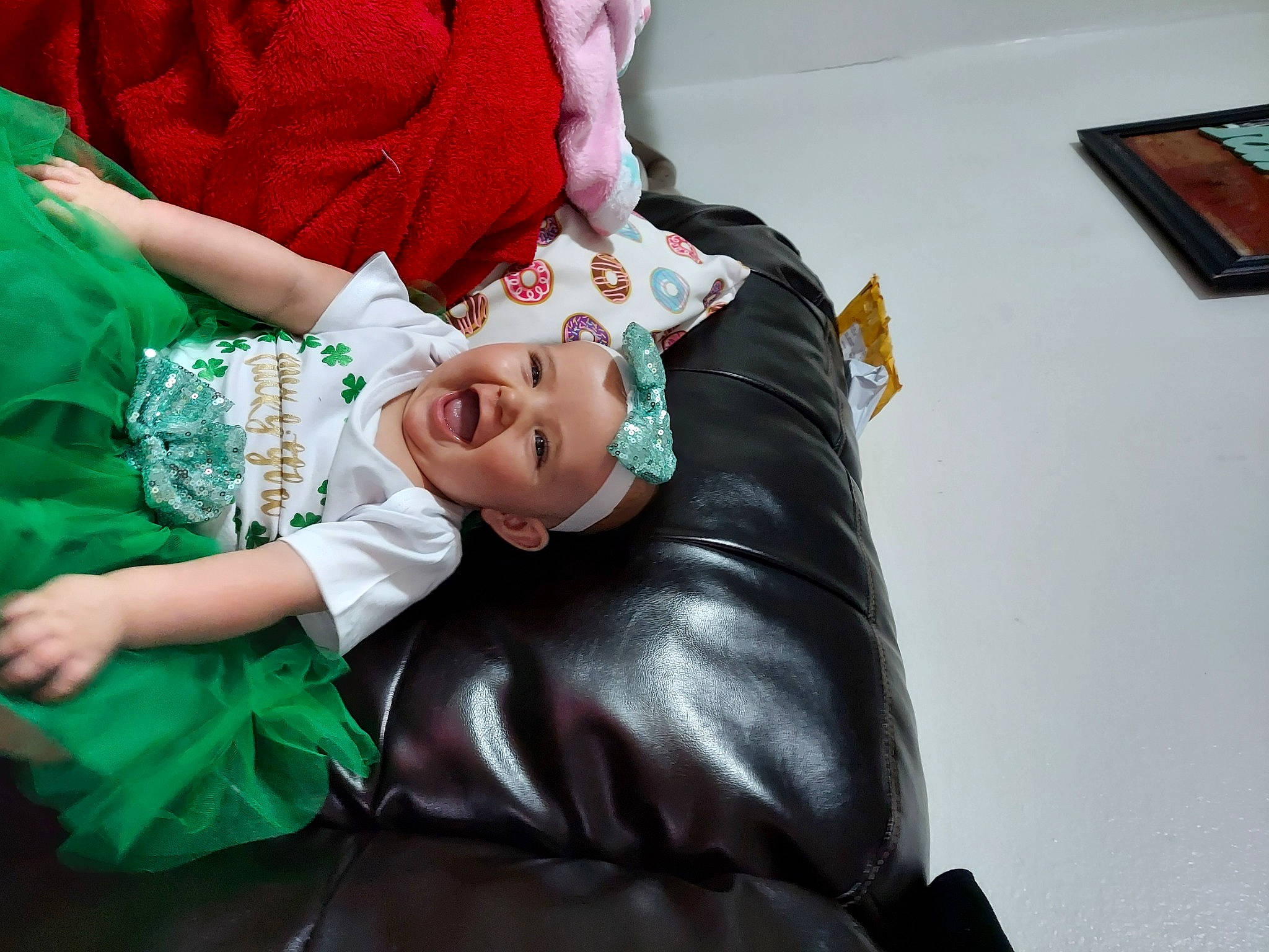 Emma joined the competition — help win amazing prizes! baby, child, comfort, costume, dress, event, fictional_character, gesture, happy, hat, headwear, jewellery, lap, magenta, person, picture_frame, purple, room, sitting, smile