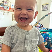 Zylen joined the competition — help win amazing prizes! baby, child, smiling, laughing, onesie, indoor, playmat, toy, happy, cute, infant, portrait, face, person, bright, colorful, short_sleeve, buttoned, home, young