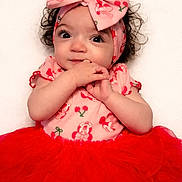 Lillyonna joined the competition — help win amazing prizes! baby, infant, tutu, headband, bow, pink, red, dress, cute, curly_hair, child, portrait, smiling, hands, sitting, fashion, adorable, eyes, clothing, person