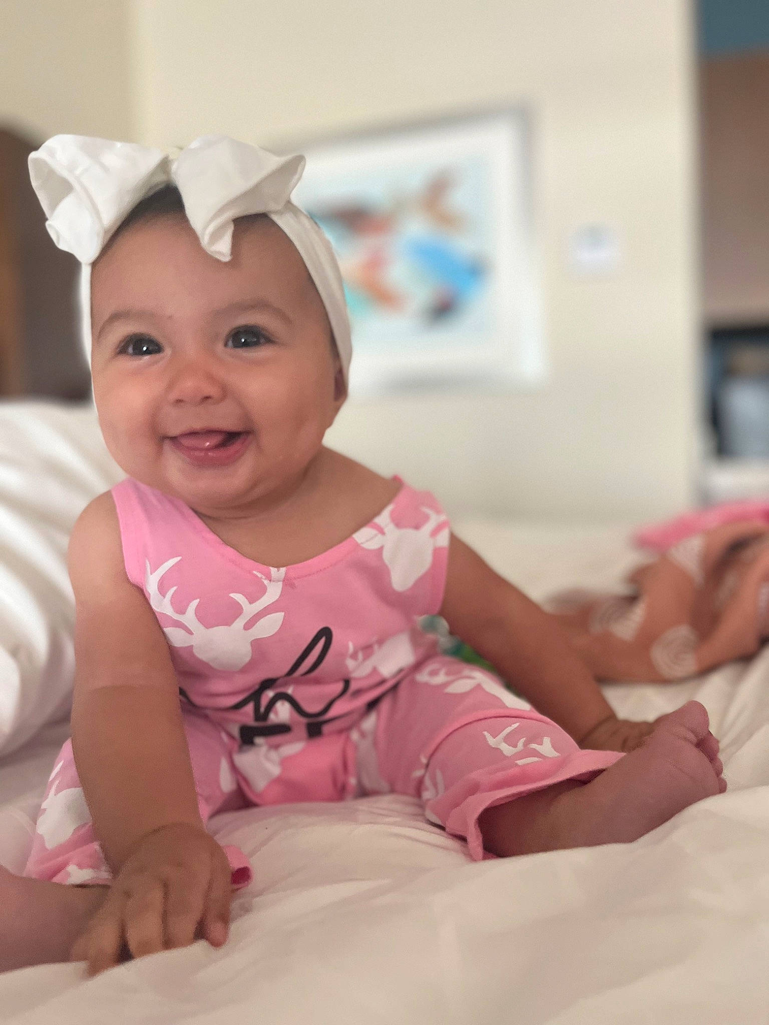 Ripley is registered to the contest to win money with this photo: baby, baby_toddler_clothing, cap, child, comfort, event, eye, fashion_accessory, fun, happy, hat, headwear, joy, magenta, person, pink, room, sitting, skin, sleeve