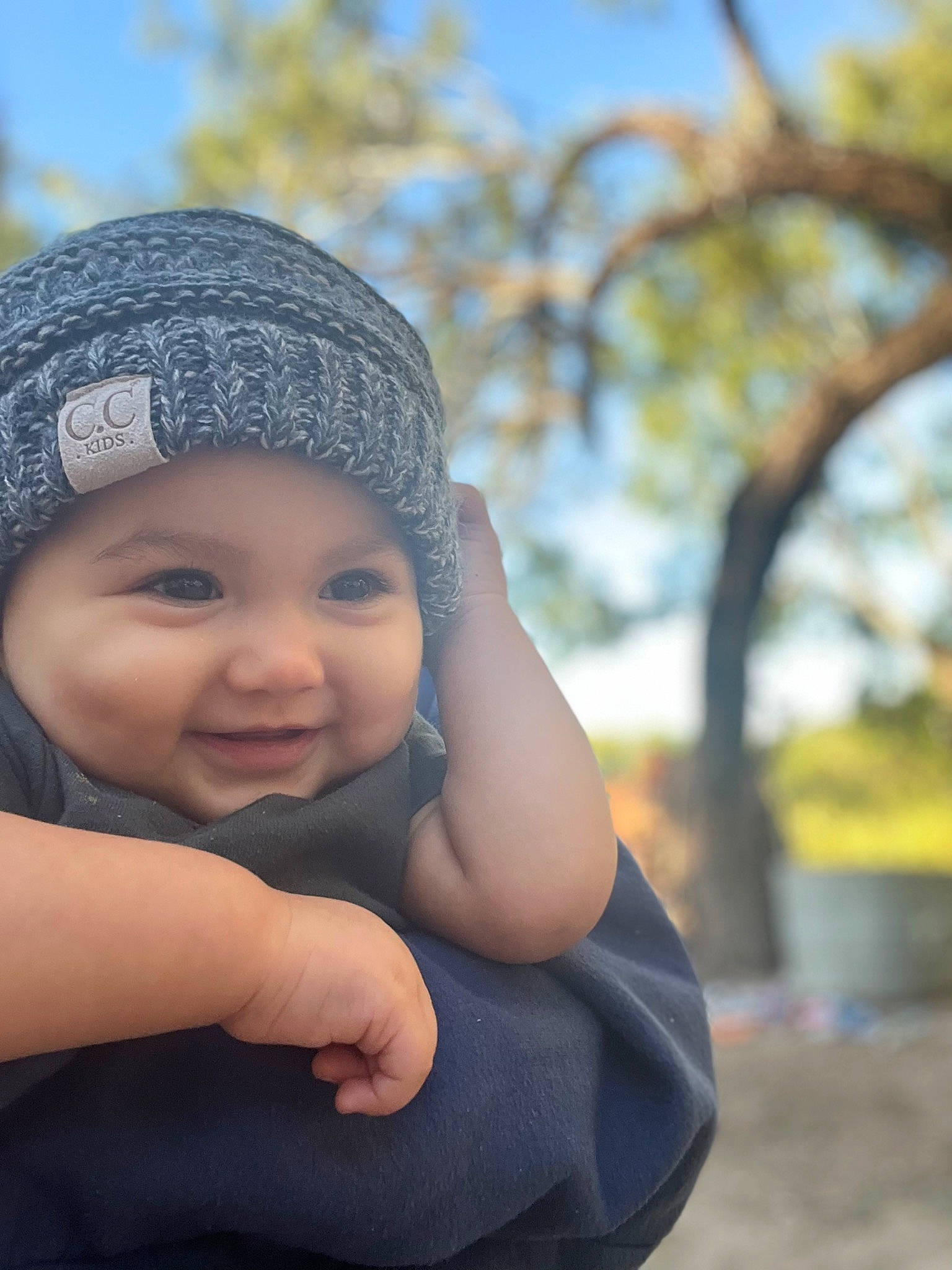 Ripley joined the competition — help win amazing prizes! baby, cap, child, eye, fashion_accessory, flash_photography, fun, gesture, grass, happy, headwear, knit_cap, leisure, lip, people_in_nature, person, portrait_photography, sitting, skin, smile