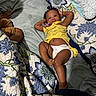 Katyria joined the competition — help win amazing prizes! baby, bed, blanket, blue, child, comfort, cute, diaper, floral_pattern, indoor, infant, lying_down, pacifier, person, quilt, relaxed, resting, sleepy, white, yellow_clothing