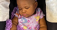 Katyria is registered to the contest to win money with this photo: baby, sleeping, infant, purple_dress, headband, car_seat, child, peaceful, cute, adorable, toddler, clothing, portrait, resting, young_child, person, baby_girl, soft_lighting, close_up, fashion