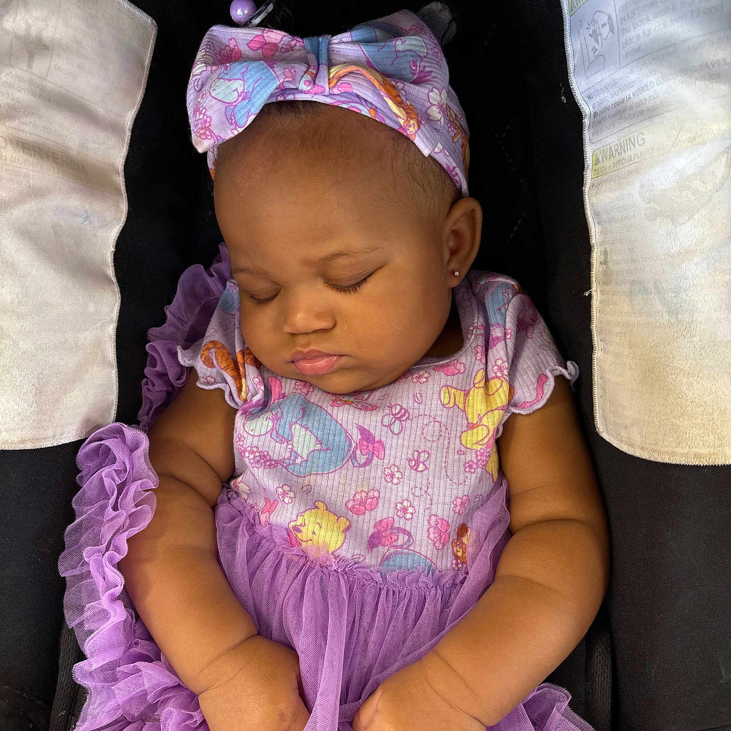 Katyria is registered to the contest to win money with this photo: baby, sleeping, infant, purple_dress, headband, car_seat, child, peaceful, cute, adorable, toddler, clothing, portrait, resting, young_child, person, baby_girl, soft_lighting, close_up, fashion