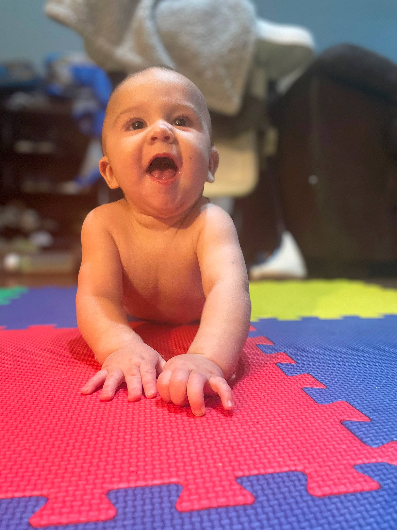 Noah joined the competition — help win amazing prizes! arm, baby, baby_toddler_clothing, blue, crawling, facial_expression, finger, floor, flooring, foot, fun, happy, human_body, leisure, mouth, person, recreation, skin, smile, toddler