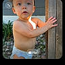 Eli joined the competition — help win amazing prizes! toddler, child, baby, outdoor, portrait, surprised, curious, standing, diaper, wooden_post, garden, plants, rocks, sunlight, face, eyes, mouth, arms, candid, camera_interface