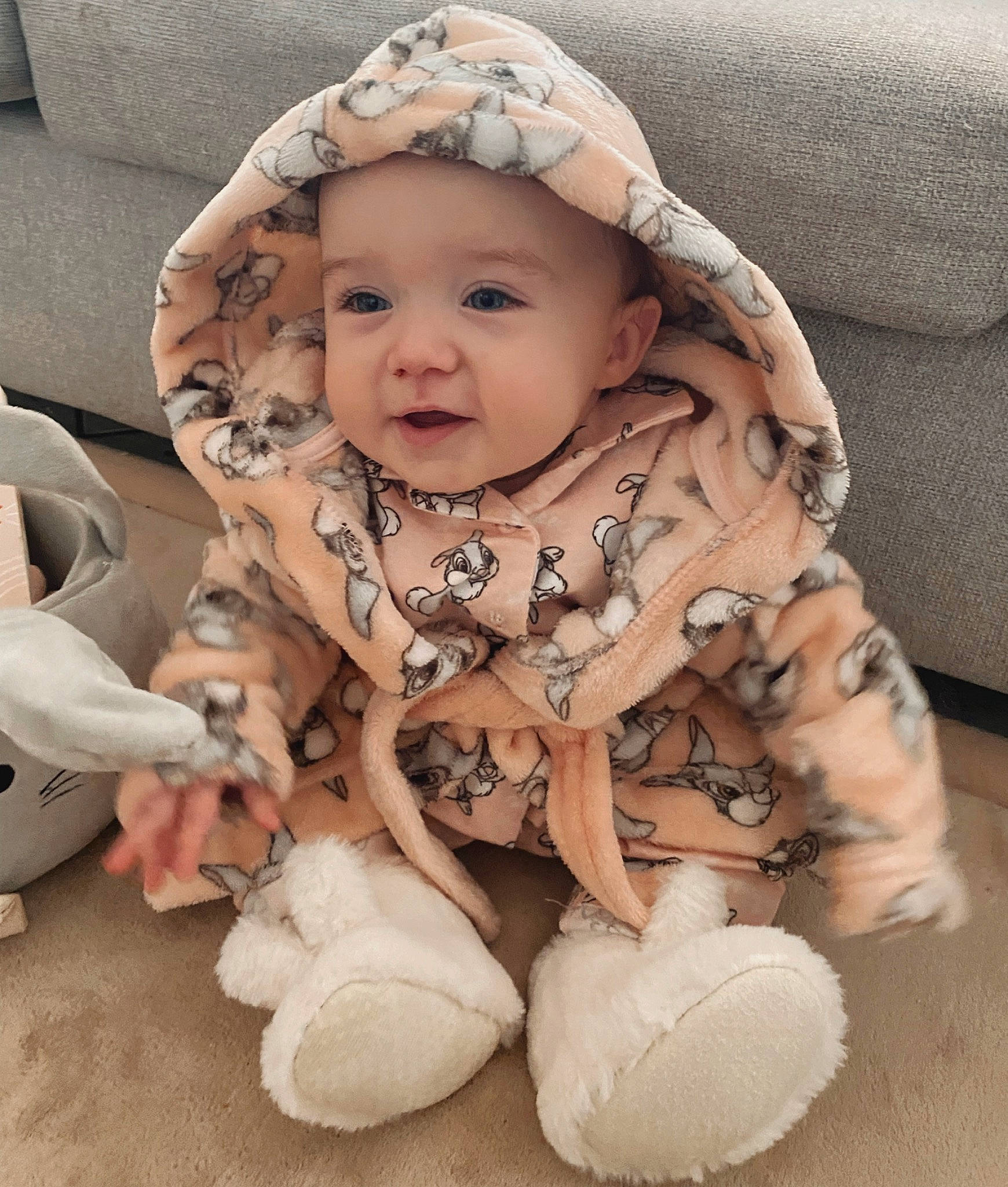Alaia is registered to the contest to win money with this photo: baby, baby_products, baby_toddler_clothing, cap, cheek, child, comfort, dress, eye, face, facial_expression, fashion_accessory, happy, head, headwear, pattern, person, sitting, skin, sleeve