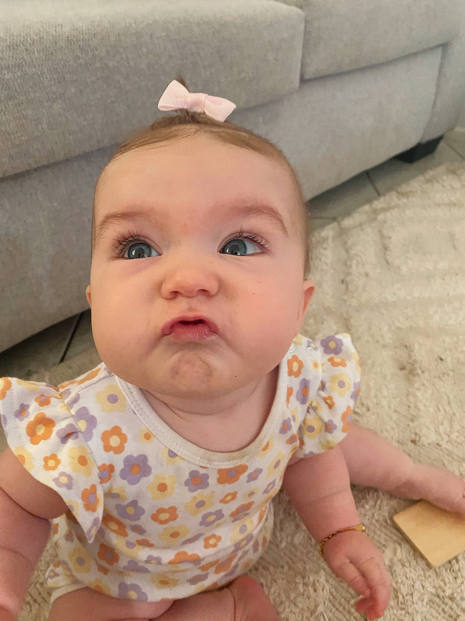 Alaia is registered to the contest to win money with this photo: baby, baby_toddler_clothing, cheek, child, comfort, eye, eyelash, finger, grass, happy, head, iris, lip, nose, pattern, person, sitting, skin, sleeve, toddler