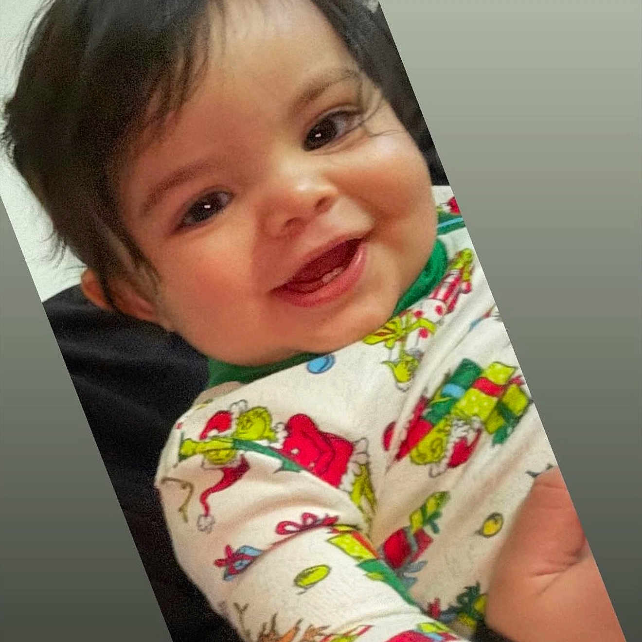 Cartier is registered to the contest to win money with this photo: baby, child, closeup, clothing, colorful, cute, eyes, face, festive, hair, happy, holiday, indoor, infant, joy, pajamas, person, portrait, skin, smile