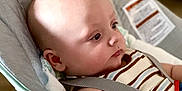Nathaniel joined the competition — help win amazing prizes! baby, infant, child, rocker, seat, striped_clothing, bald, face, head, arm, indoor, soft_light, cushion, safety_strap, person, young_child, portrait, side_view, calm, seated