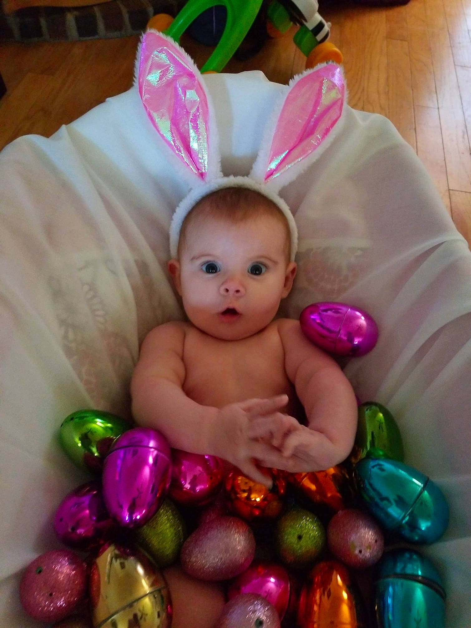 Mallie is registered to the contest to win money with this photo: baby, child, ear, easter, easter_bunny, easter_egg, egg, food, holiday, iris, person, pink, surprise, toddler