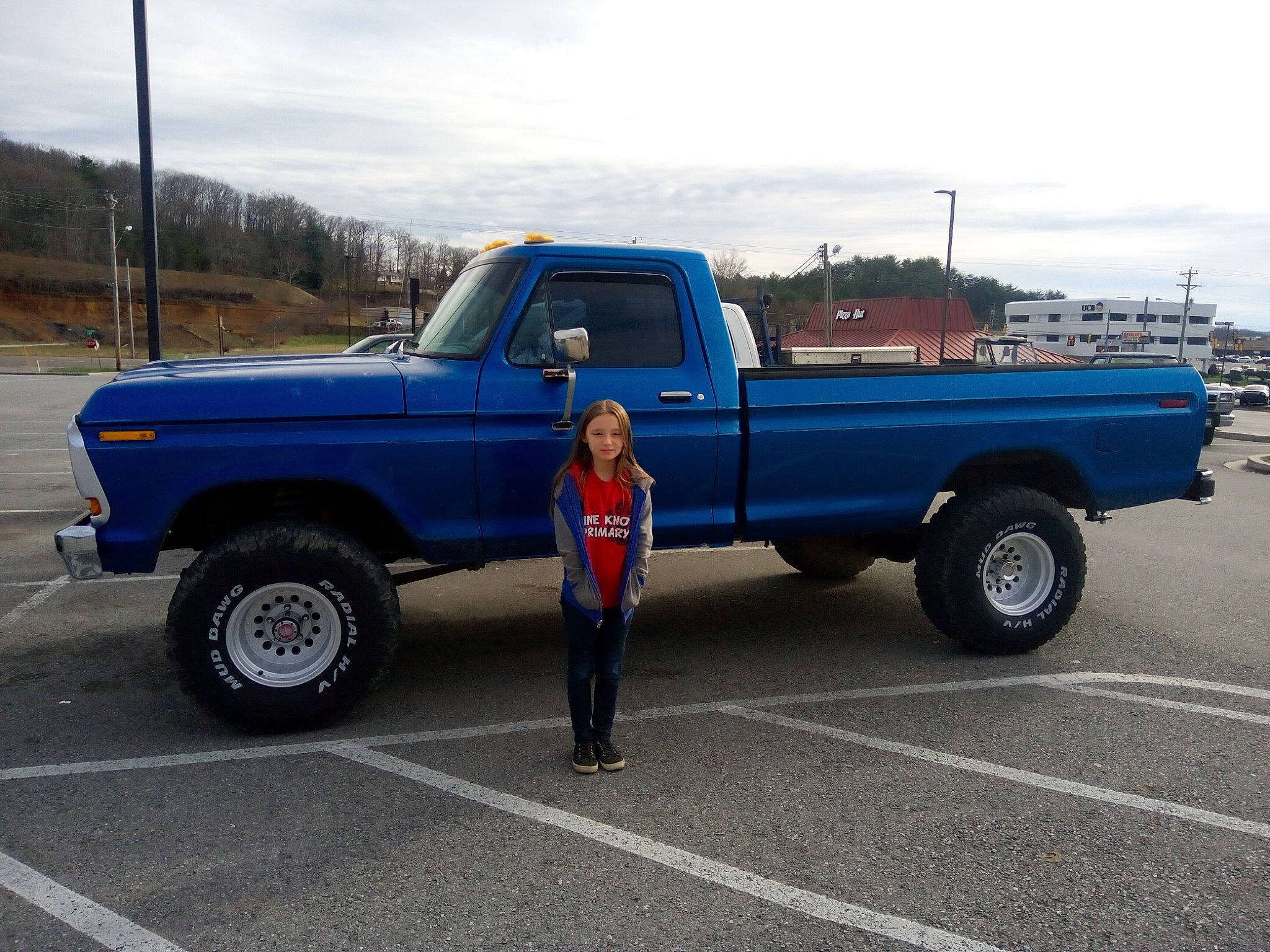 Angie joined the competition — help win amazing prizes! asphalt, automotive_design, automotive_exterior, automotive_tire, automotive_wheel_system, bumper, car, cloud, hood, light_commercial_vehicle, locking_hubs, mode_of_transport, motor_vehicle, person, road_surface, sky, tire, tread, truck, vehicle