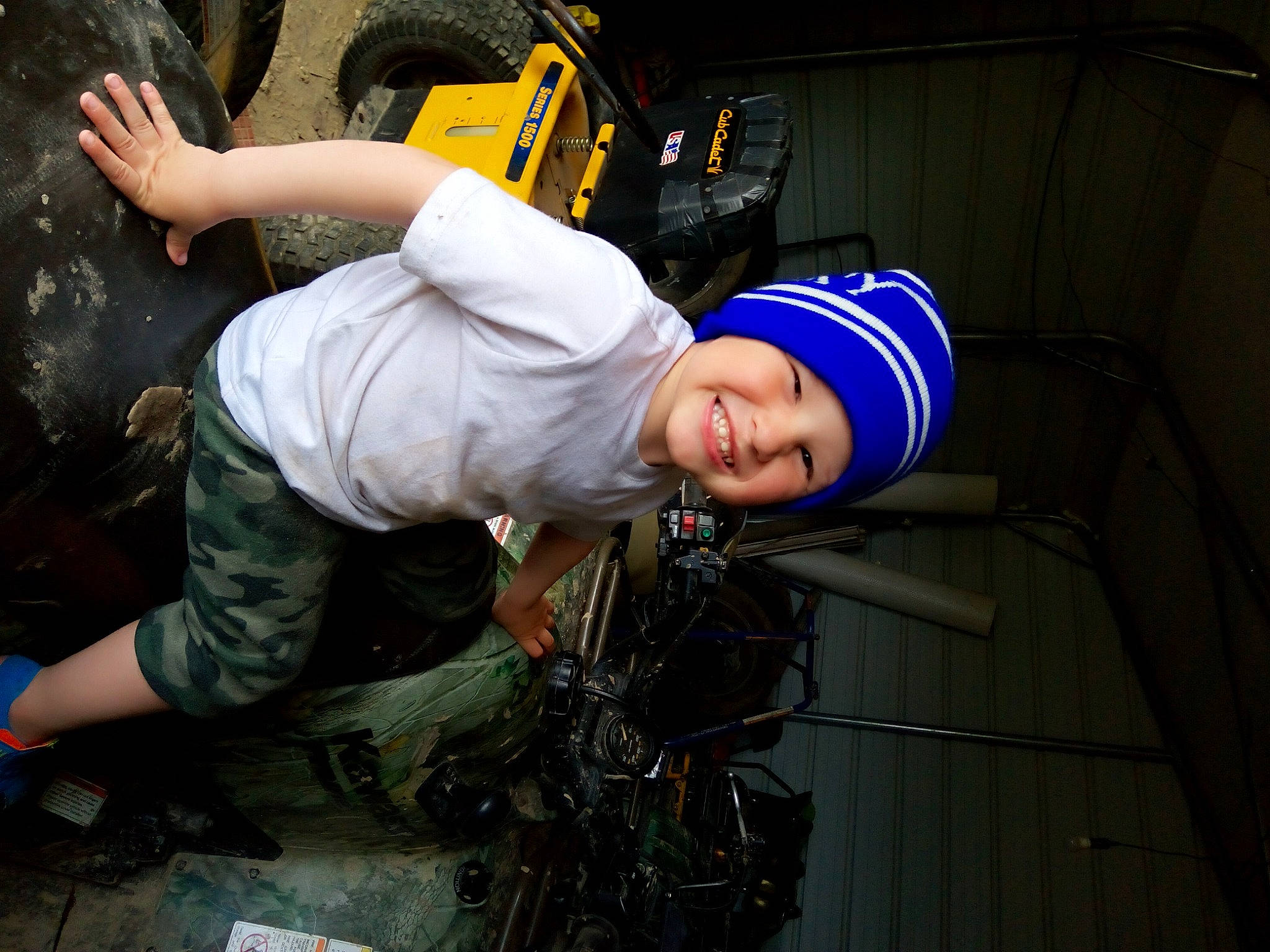 Jared is registered to the contest to win money with this photo: adventure, asphalt, auto_part, automotive_tire, automotive_wheel_system, blue_collar_worker, engineering, flash_photography, fun, headwear, helmet, joy, mechanic, military_camouflage, military_person, motor_vehicle, person, personal_protective_equipment, smile, t_shirt