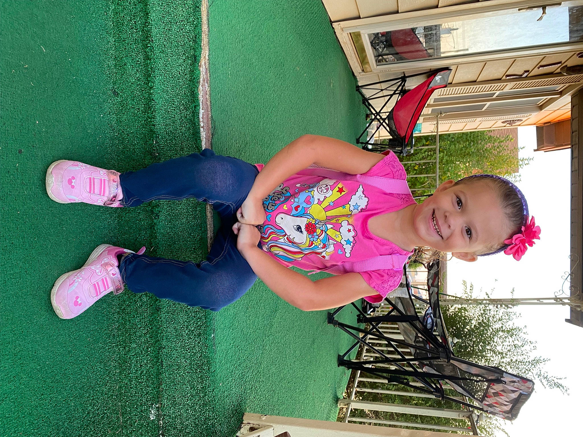 Lizzie is registered to the contest to win money with this photo: baby_toddler_clothing, child, fun, grass, green, happy, hat, human_leg, joy, leisure, magenta, pattern, person, pink, play, recreation, sandal, smile, thigh, toddler