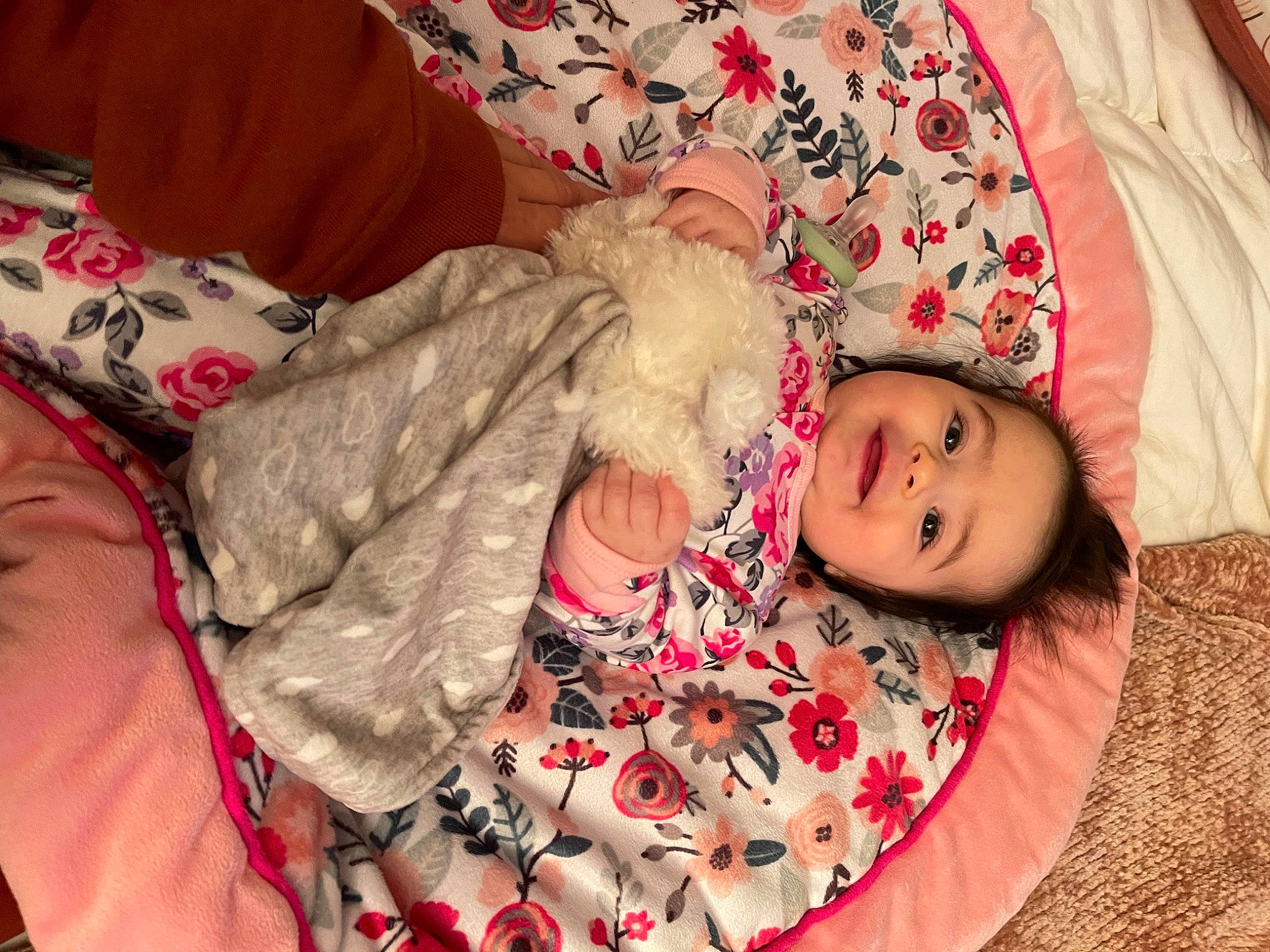 Arielle joined the competition — help win amazing prizes! baby, baby_toddler_clothing, child, comfort, couch, event, facial_expression, finger, happy, joy, linens, magenta, pattern, person, pink, room, sitting, skin, textile, thigh