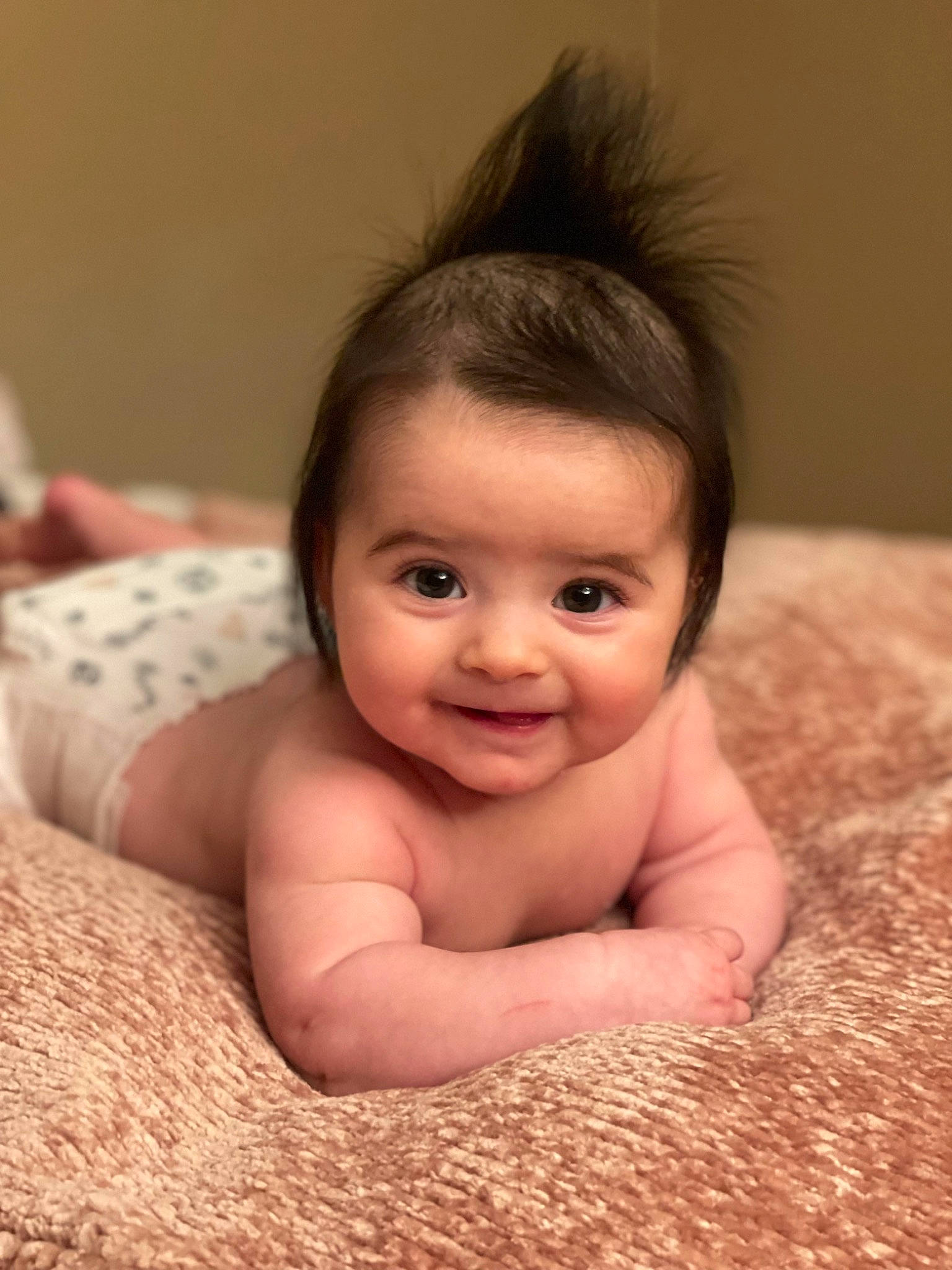 Arielle is registered to the contest to win money with this photo: baby, barechested, cheek, chest, child, chin, comfort, eyelash, flash_photography, floor, flooring, fun, fur, happy, iris, joy, lip, nose, person, skin