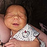 Kairi is registered to the contest to win money with this photo: baby, newborn, infant, sleeping, smiling, person, child, cute, hello_kitty, clothing, hand, arm, skin, portrait, indoors, closeup, resting, peaceful, young, human