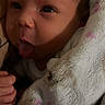Kairi is registered to the contest to win money with this photo: baby, child, face, tongue, blanket, soft, cute, infant, newborn, wrapped, expression, skin, hand, cozy, warm, portrait, indoors, person, closeup, sleepwear