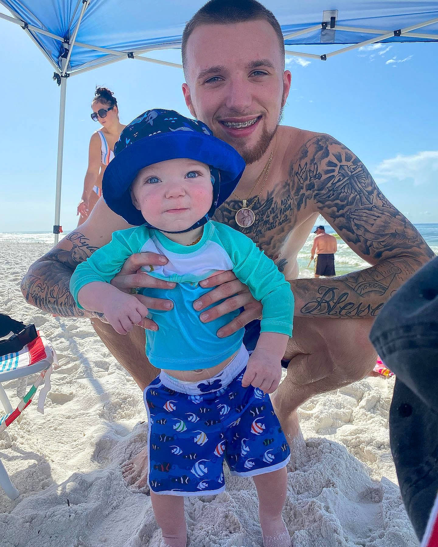Kylen joined the competition — help win amazing prizes! azure, beach, blue, cool, electric_blue, event, fun, happy, headwear, joy, leg, leisure, muscle, organ, person, recreation, sand, shorts, sky, smile