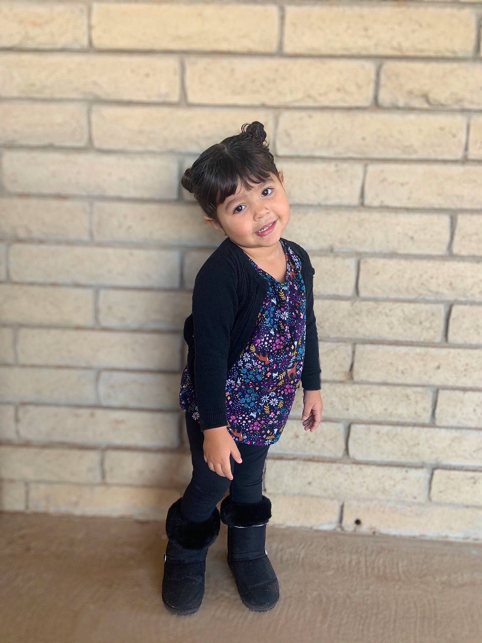 Amarah is registered to the contest to win money with this photo: baby_toddler_clothing, brick, denim, electric_blue, eye, flash_photography, footwear, hair, happy, joy, knee, leg, pattern, person, personal_protective_equipment, sleeve, standing, street_fashion, t_shirt, toddler