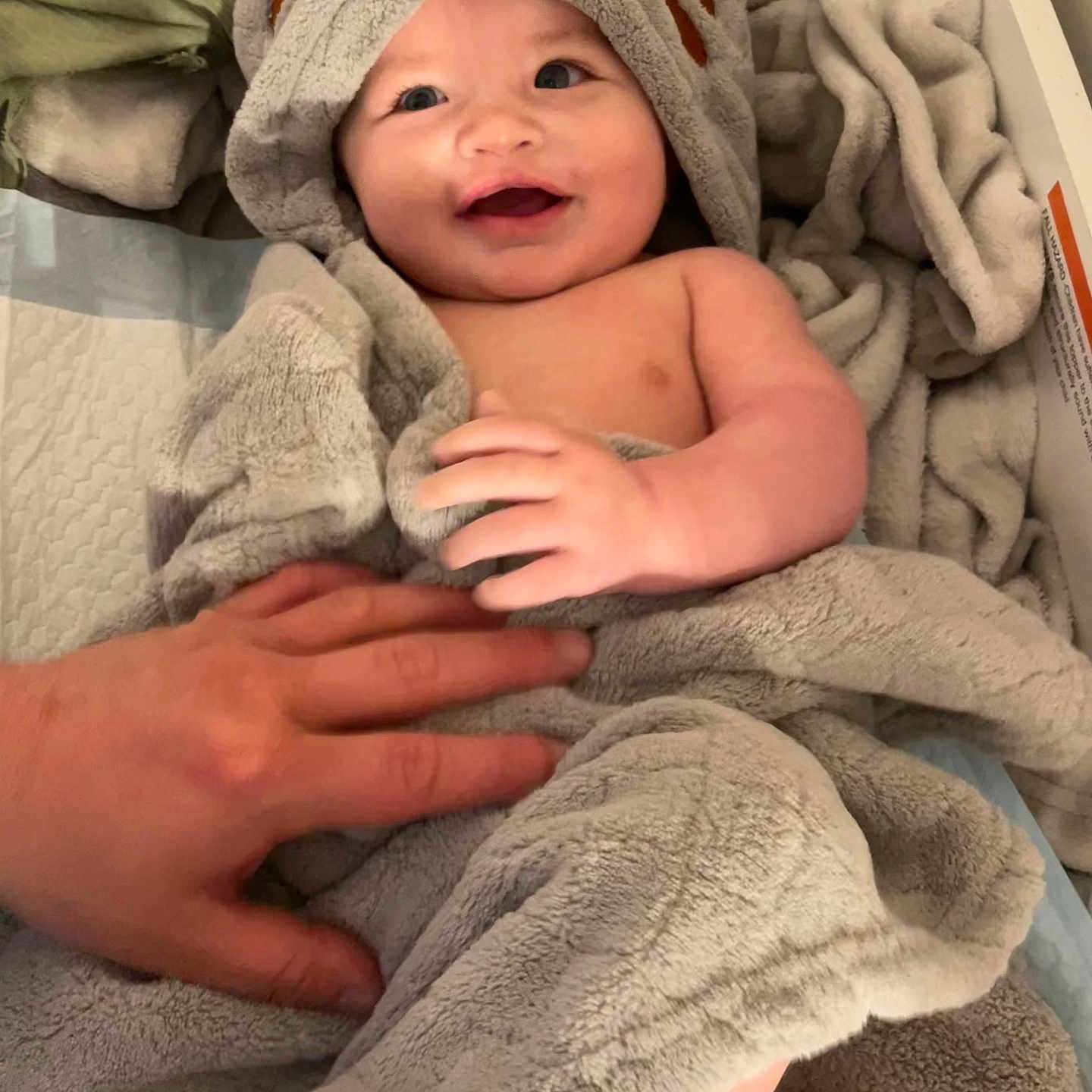 Lucas joined the competition — help win amazing prizes! animal_hood, baby, blanket, child, comfort, cozy, cute, hand, happy, indoors, infant, person, playful, skin, smiling, soft_texture, toddler, towel, warm, wrapped
