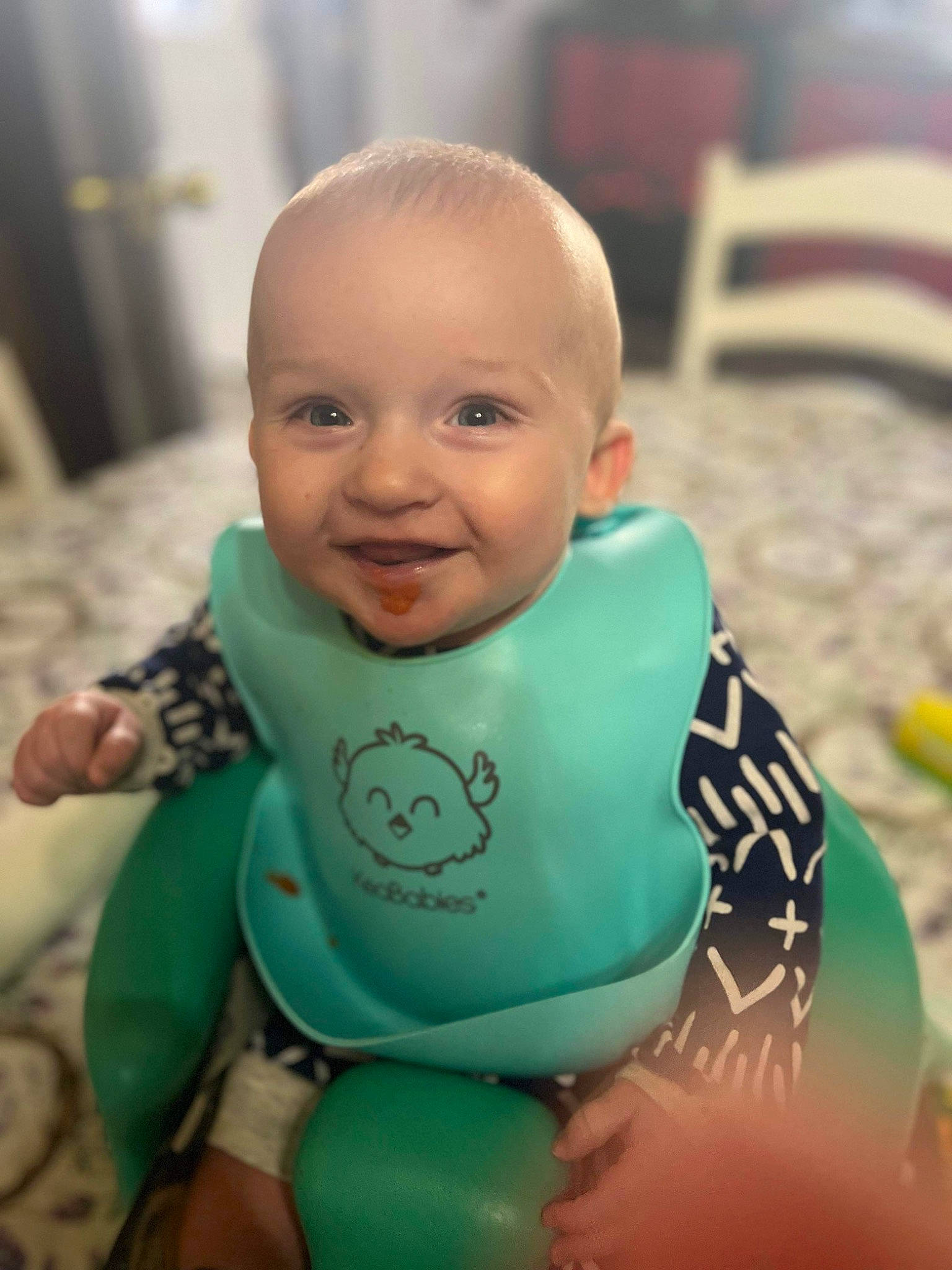 Waylon joined the competition — help win amazing prizes! baby, baby_products, baby_toddler_clothing, bib, cheek, child, drinkware, eye, face, finger, happy, head, joy, leisure, mammal, person, sitting, skin, sleeve, smile