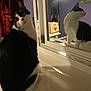 Kitty joined the competition — help win amazing prizes! cat, black_and_white, reflection, mirror, indoor, pet, animal, purple_wall, household_items, feline, looking_back, sitting, white_surface, cozy, domestic, fur, whiskers, ears, window_sill, curiosity