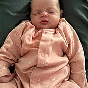 Mia joined the competition — help win amazing prizes! baby, sleeping, onesie, pink_clothing, infant, cute, child, soft_fabric, peaceful, face, hands, newborn, resting, cozy, portrait, human, indoor, closeup, young_child, adorable