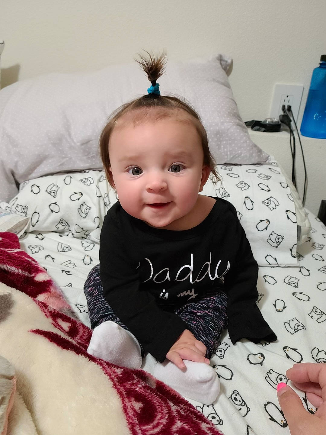 Addelynn is registered to the contest to win money with this photo: baby, baby_toddler_clothing, cheek, child, comfort, couch, eye, face, happy, iris, linens, pattern, person, pink, sitting, skin, sleeve, smile, t_shirt, toddler