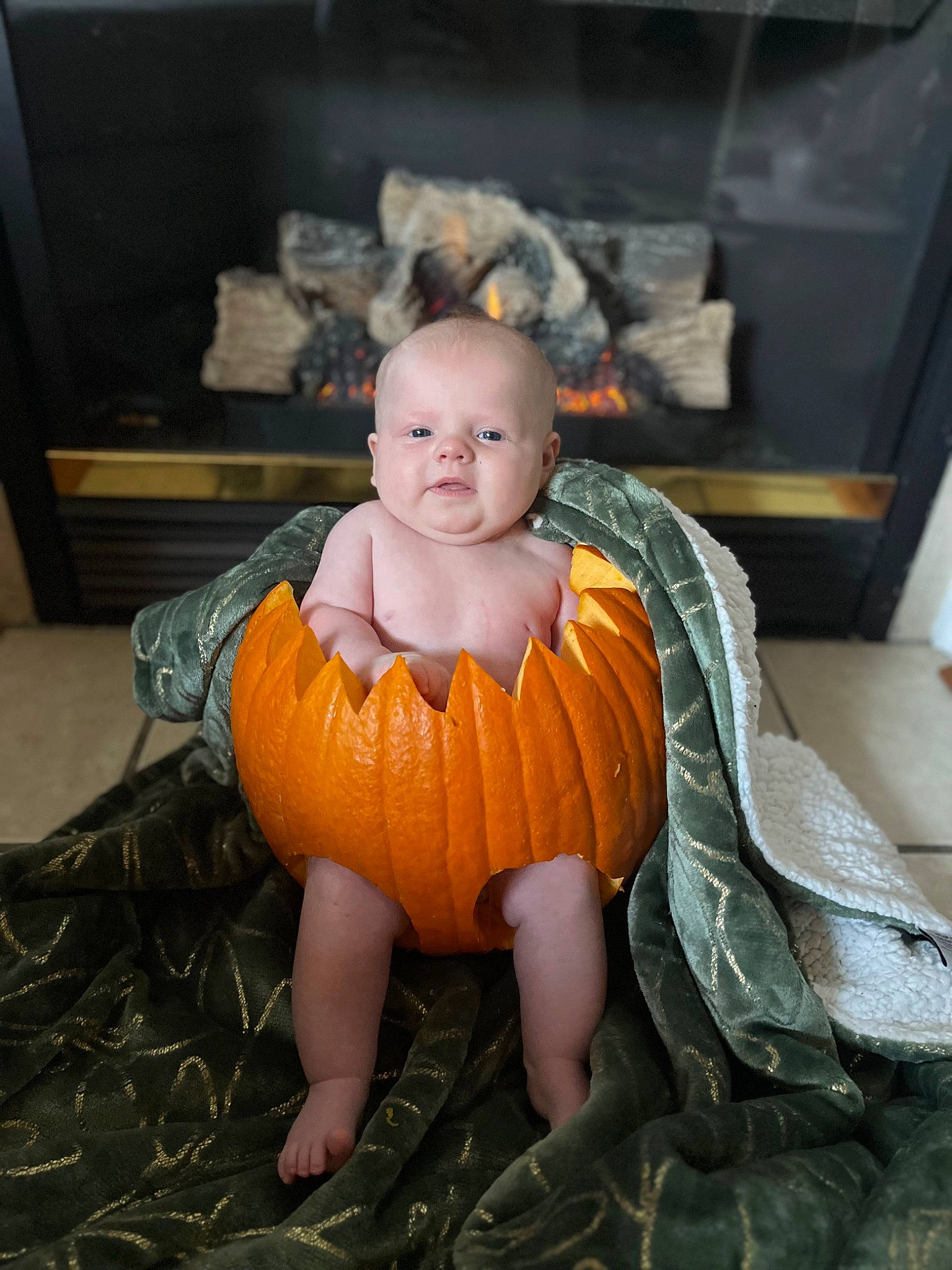 Oliver is registered to the contest to win money with this photo: art, baby, calabaza, child, cucurbita, eye, flooring, fruit, gourd, head, human_body, natural_foods, orange, person, plant, pumpkin, sitting, squash, vegetable, winter_squash