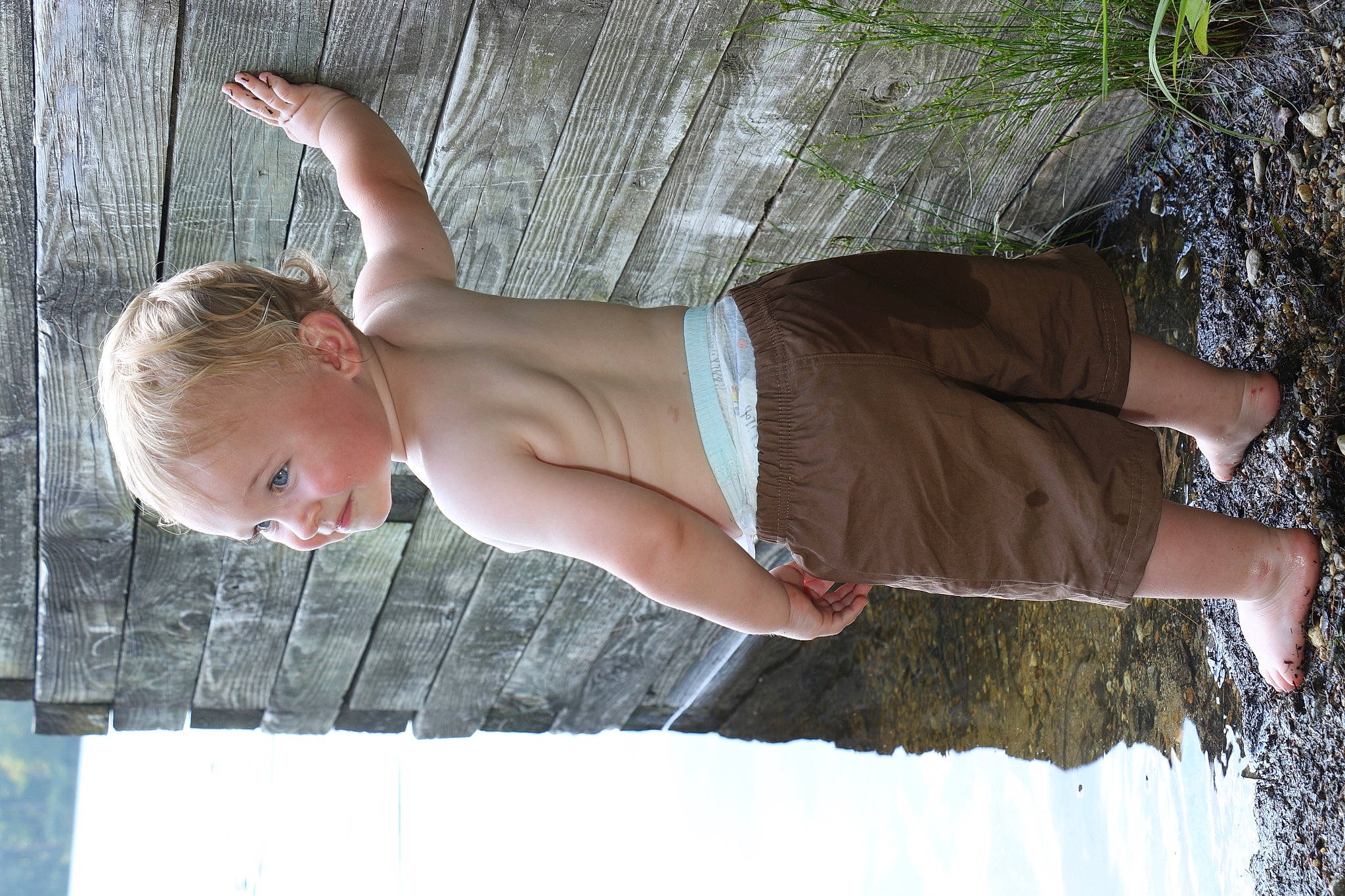 Drew is registered to the contest to win money with this photo: arm, barechested, chest, elbow, fun, glasses, human_body, human_leg, joint, knee, leg, leisure, people_in_nature, person, thigh, toddler, tree, trunk, waist, wood