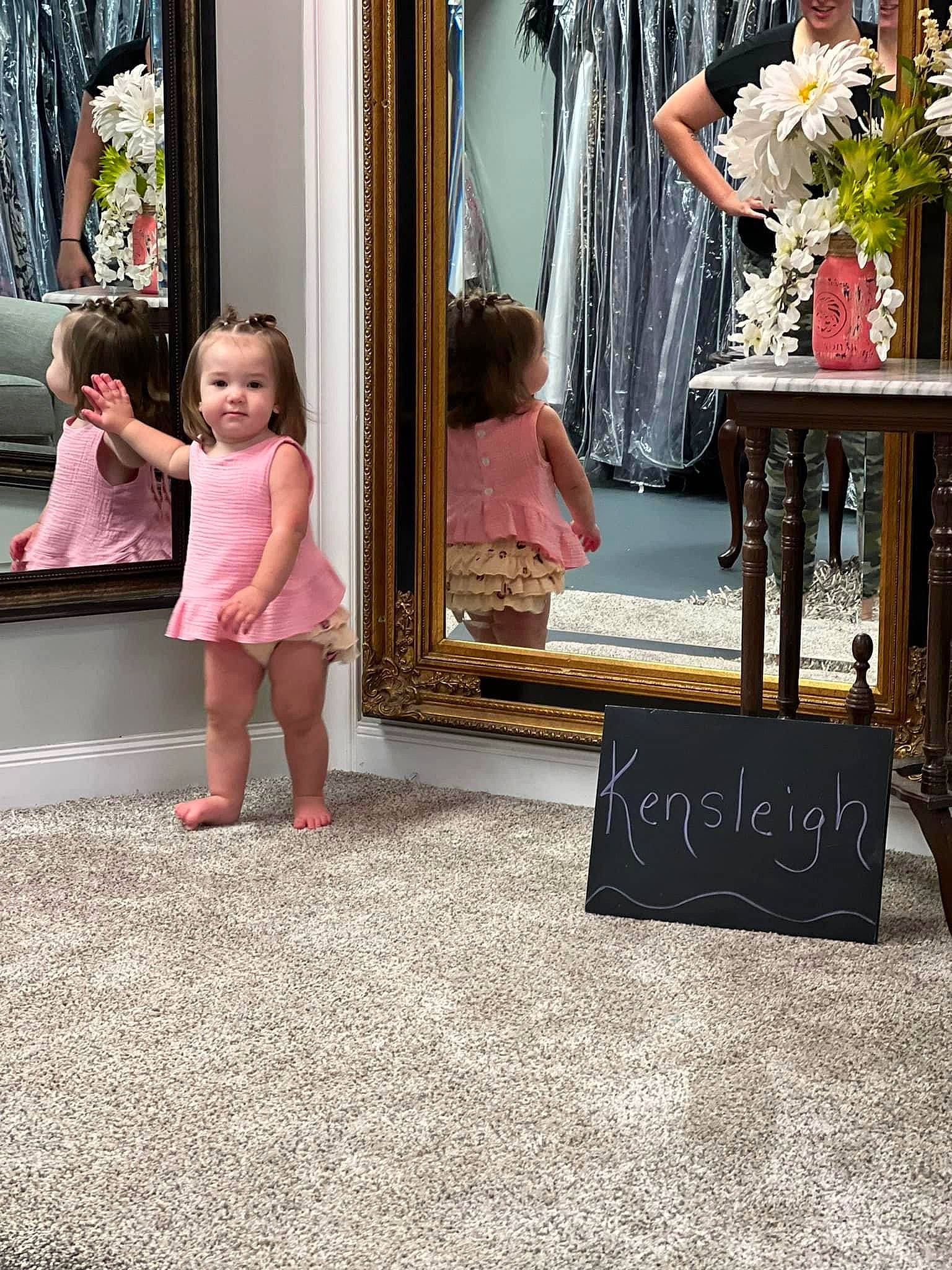 Kensleigh Sexton is registered to the contest to win money with this photo: chair, child, curtain, dress, event, fashion, fashion_design, flooring, flower, flower_arranging, human_leg, interior_design, magenta, person, pink, plant, room, rose, textile, toddler