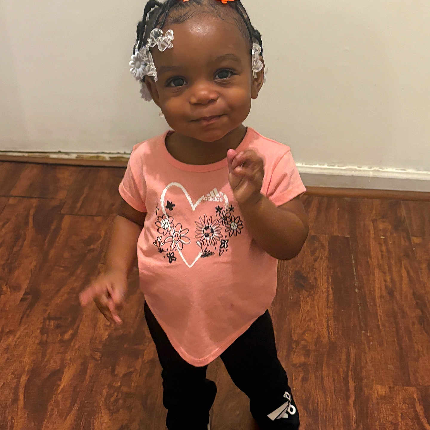 Arielle joined the competition — help win amazing prizes! bodypart, child, clothing, face, female, finger, footwear, girl, hand, happy, hardwood, head, person, photography, portrait, shoe, sitting, smile, sneaker, wood