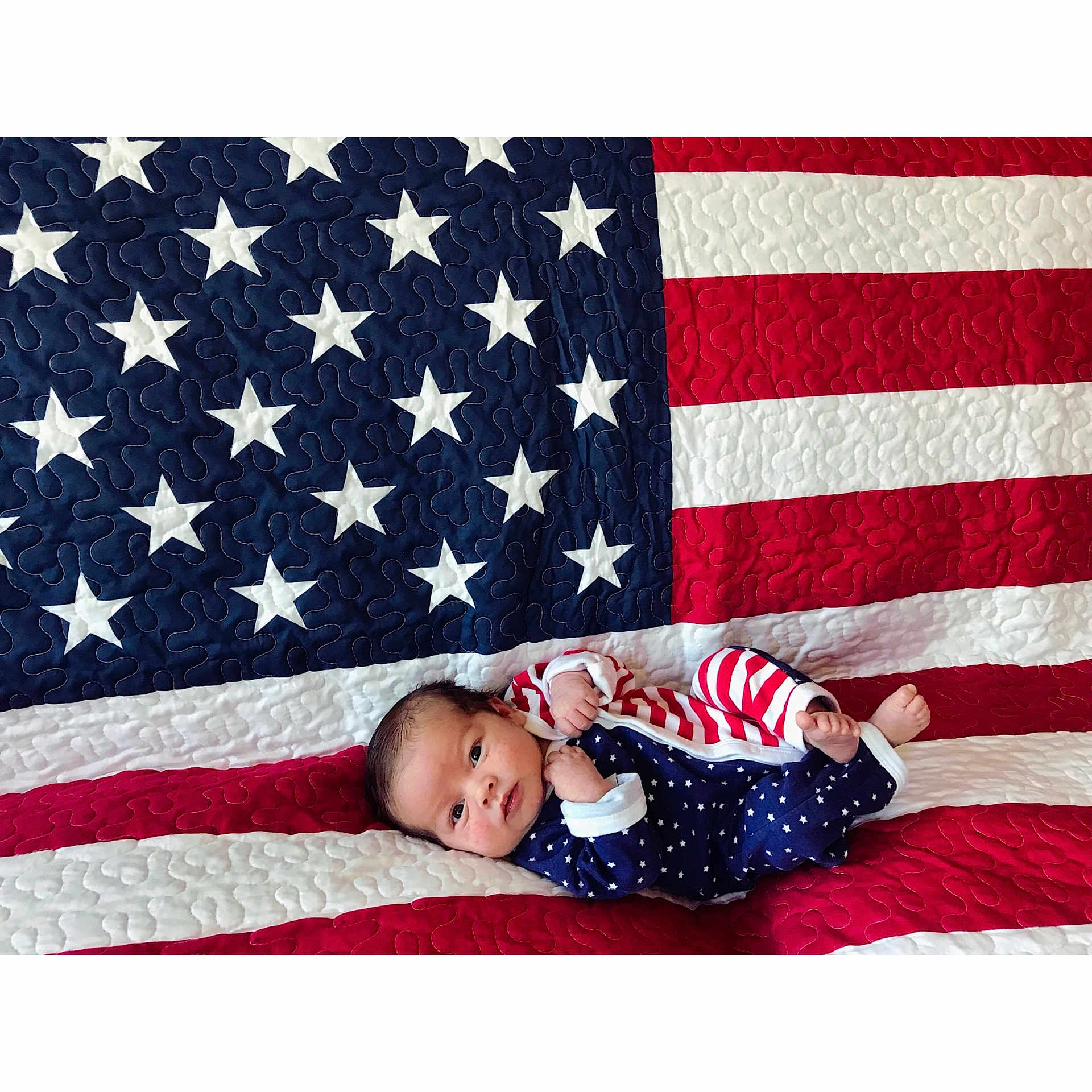 Levin is registered to the contest to win money with this photo: child, flag, flag_day_usa, flag_of_the_united_states, pattern, person, rectangle