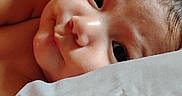 Pyper is registered to the contest to win money with this photo: baby, infant, face, skin, pillow, plush_toy, close_up, cute, child, sleeping, soft, indoors, young, portrait, resting, bed, comfort, expression, head, blanket