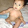 Pyper joined the competition — help win amazing prizes! baby, infant, child, surprised, wide_eyes, bottle, blanket, diaper, sitting, soft_fabric, indoors, couch, cute, skin, expression, young, person, head, face, chubby