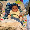 Dariel joined the competition — help win amazing prizes! baby, infant, child, portrait, sitting, baby_chair, pacifier, blanket, bib, clothing, face, eyes, hair, indoor, bedroom, window, curtains, colorful, furniture, cozy