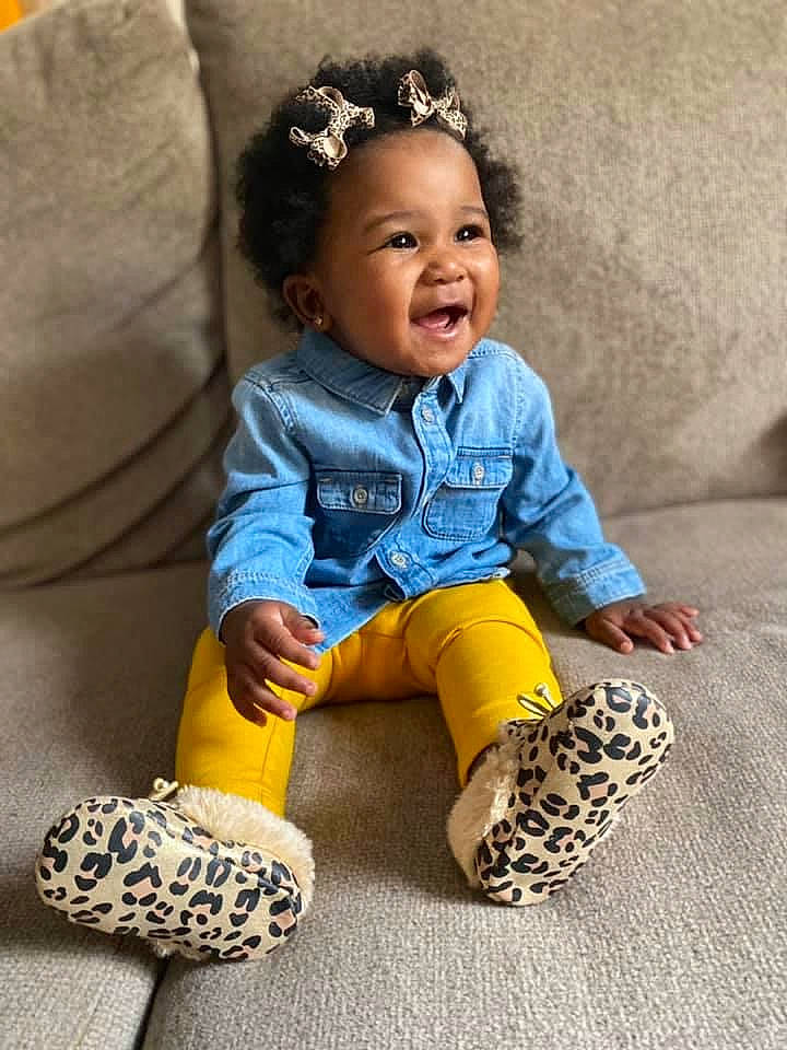 Jaida is registered to the contest to win money with this photo: baby, baby_products, baby_toddler_clothing, blue, child, child_model, jeans, pattern, person, play, shoe, sitting, toddler, toy, yellow